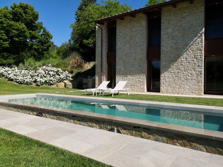 Villa with pool and garden, surrounded by greenery, ideal for relaxation and leisure.