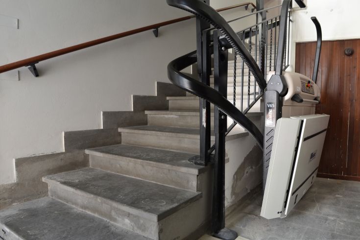 Elevator for disabled access located in a bright, contemporary environment.