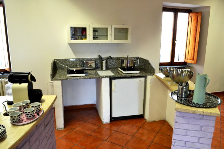 Well-lit, fully equipped kitchen suitable for preparing meals independently.