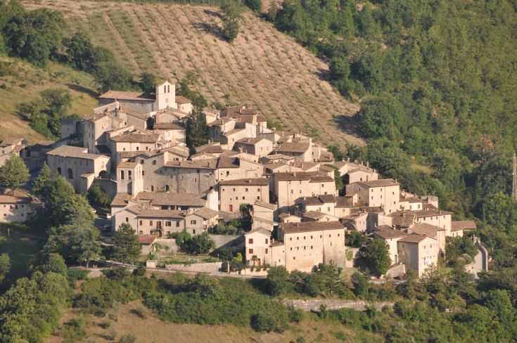 A historic stone village, surrounded by lush greenery and gentle hills. A quiet and charming place.