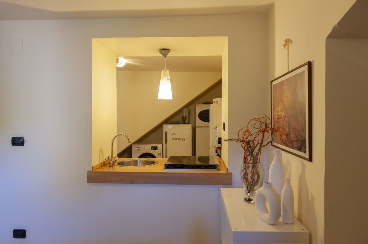 A modern kitchen corner with modern elements and simple decorations.