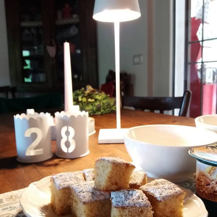 A simple dessert displayed on a tidy table, bathed in natural light.