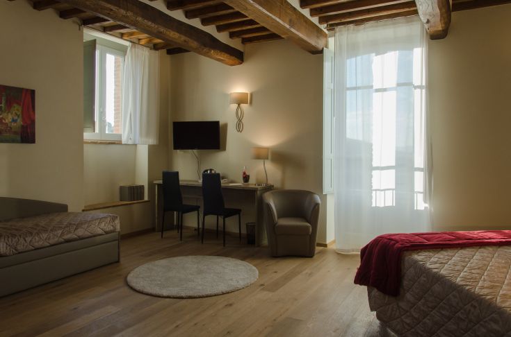 Cozy and bright room in the Ancient Sipario Palace, located in the charming town of Paciano in Umbria.