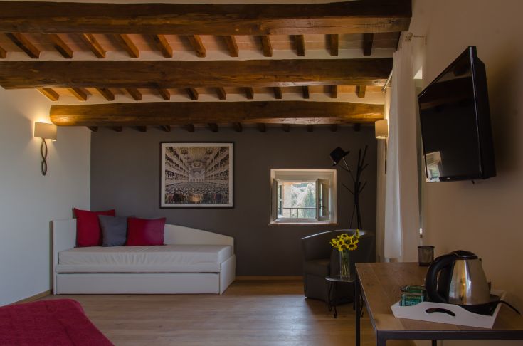 A room in a building, featuring simple decor and practical details.