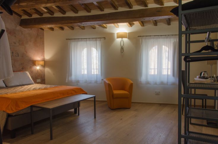 Charming hotel room with tasteful decor and a serene atmosphere.