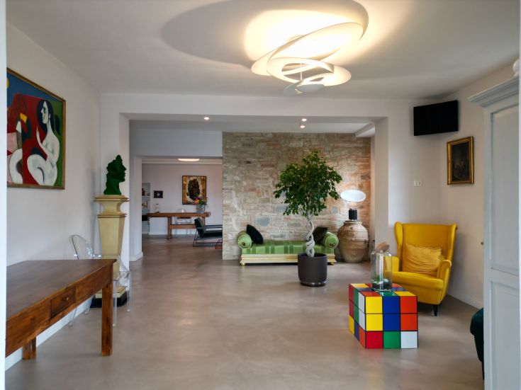 Bright and simple interior of a B&B, featuring functional furnishings and cozy spaces.