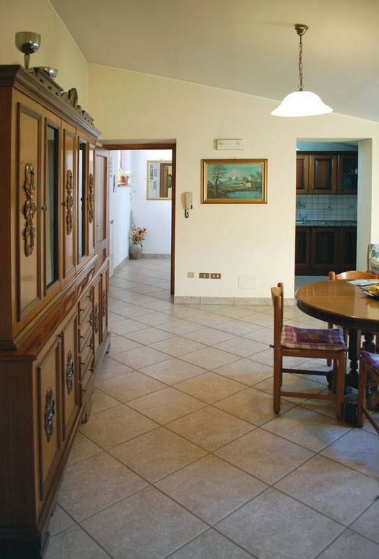 Room with dining table and large wardrobe