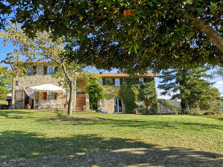 A building surrounded by greenery, perfect for enjoying pleasant walks in nature.