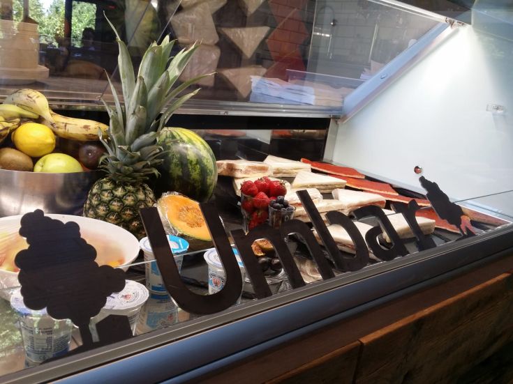 Showcase of fresh fruit and desserts in a simple, welcoming space.