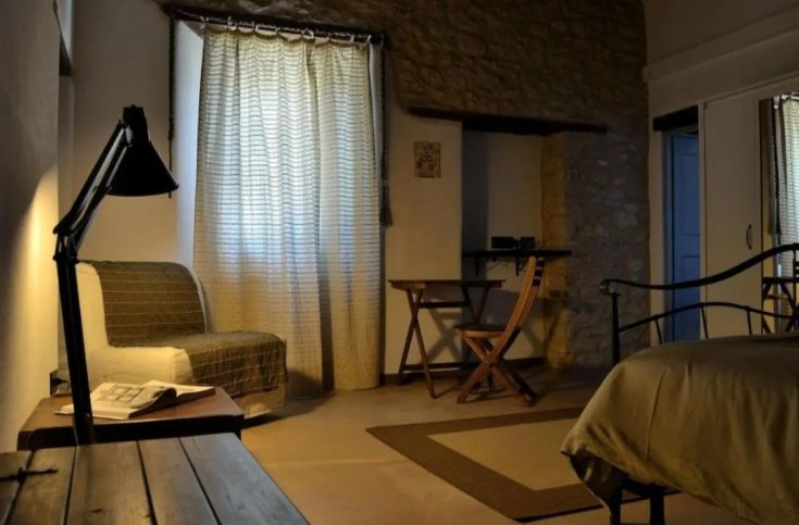 Bright room with essential furnishings, perfect for moments of relaxation and tranquility.