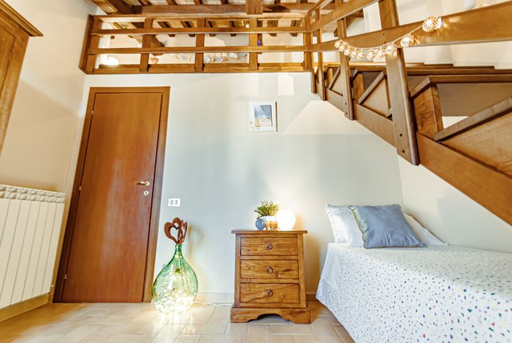 Spacious and well-lit apartment with a loft, perfect for families seeking comfort.