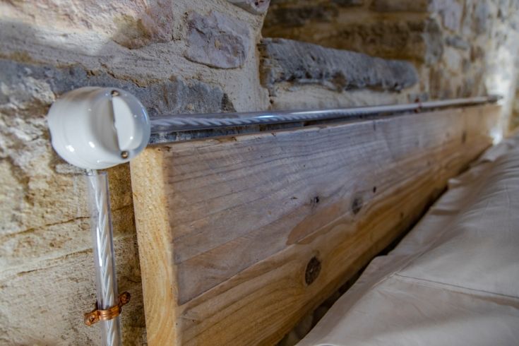 A rustic living room featuring natural materials and simple decor, perfect for moments of relaxation and tranquility.