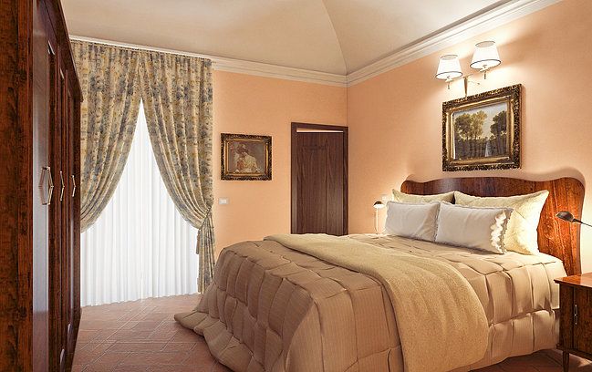 Camera semplice con letto matrimoniale e arredi classici, ideale per un soggiorno tranquillo.