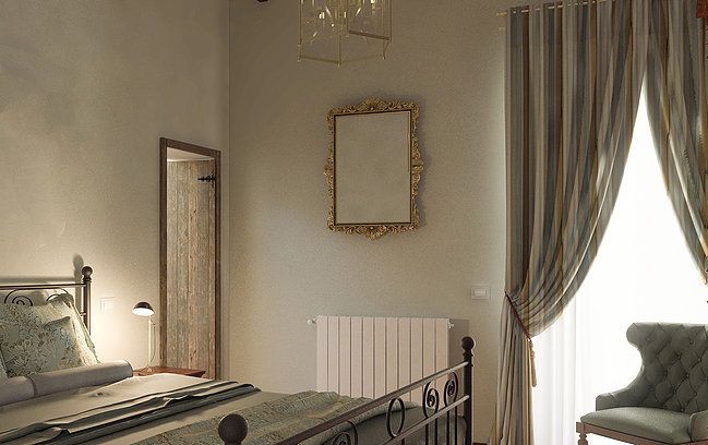 Camera luminosa in un palazzo, con arredamento sobrio e una sensazione accogliente.