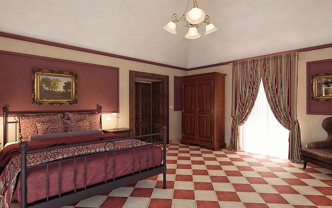 Camera in una vecchia dimora, con pavimento a scacchi bianchi e neri e arredi semplici.