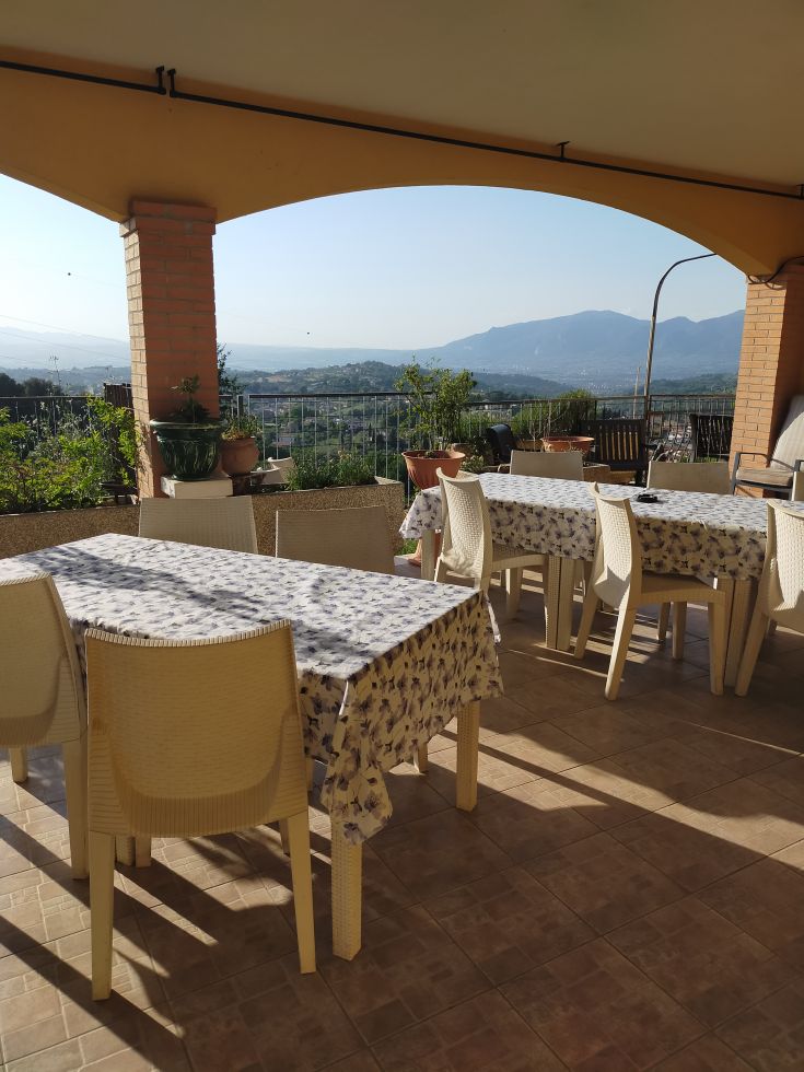 Serene environment with a relaxing view, tables ready for outdoor breakfasts.