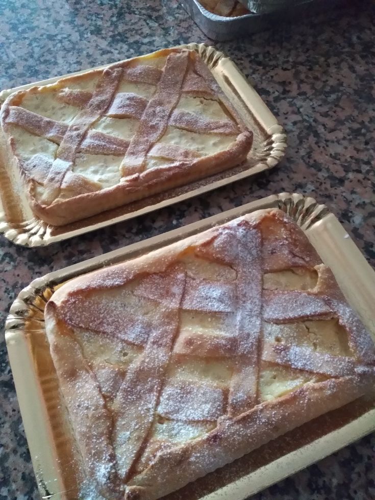Baked tarts dusted with powdered sugar, ready to be served and enjoyed.