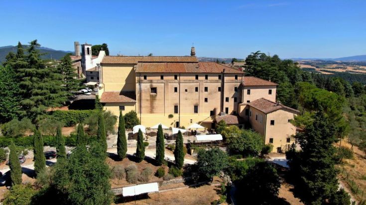 A renovated Cistercian monastery located in a typical natural area of Umbria.