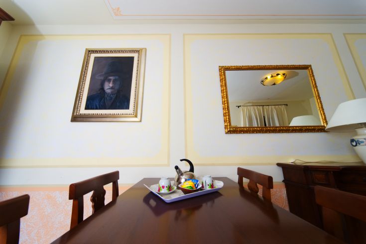 A serene interior with a table and decorative elements, creating a cozy space for relaxation.