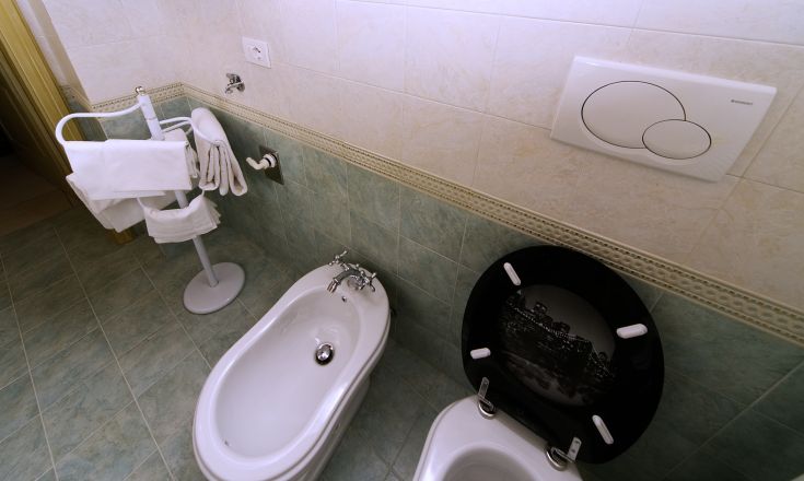Contemporary bathroom with bidet and modern features, ideal for a vacation home.