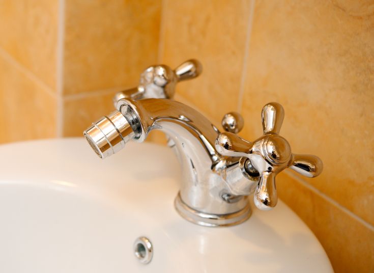 Elegant faucet with a simple design in a sleek and functional bathroom.