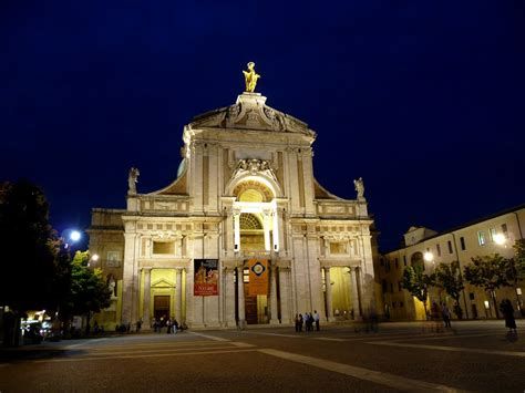A lit monument at night, representing the history and culture of the surrounding area.