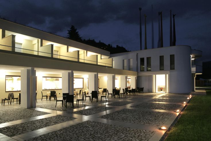 Modern hotel located by a lake, perfect for a peaceful nature retreat.