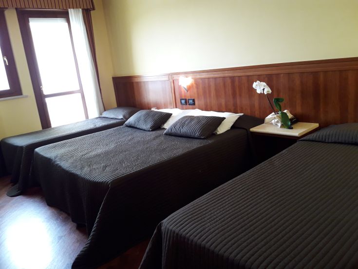 Comfortable hotel room with tidy beds and understated decorations.