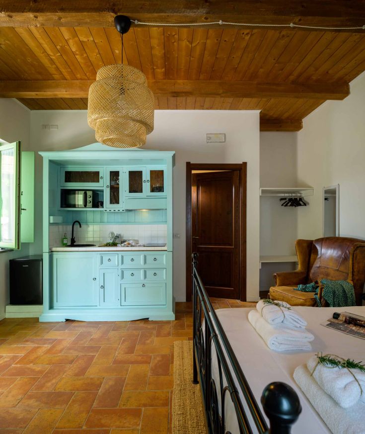 Cozy environment with rustic designed kitchen and furnishings.