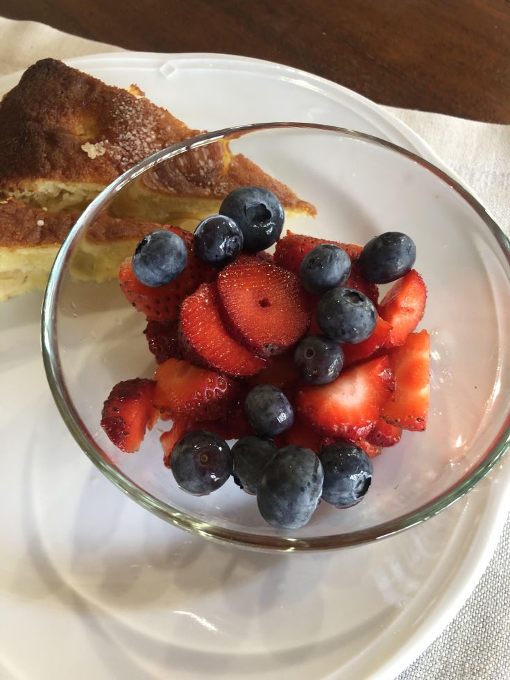 A platter of fresh strawberries and blueberries, perfect for a light snack.