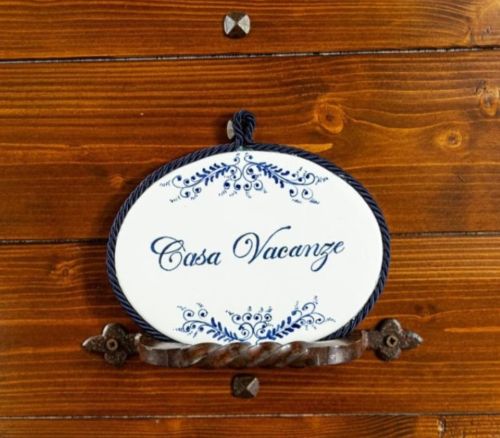 Wooden doors and a simple sign for a cozy vacation home, a typical refuge for guests.