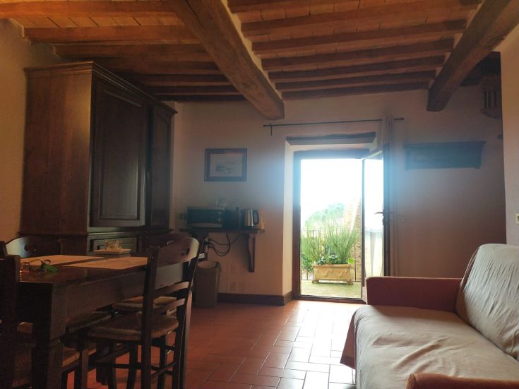 Cozy interior featuring rustic elements and a view of a well-kept garden. A serene and comfortable environment.