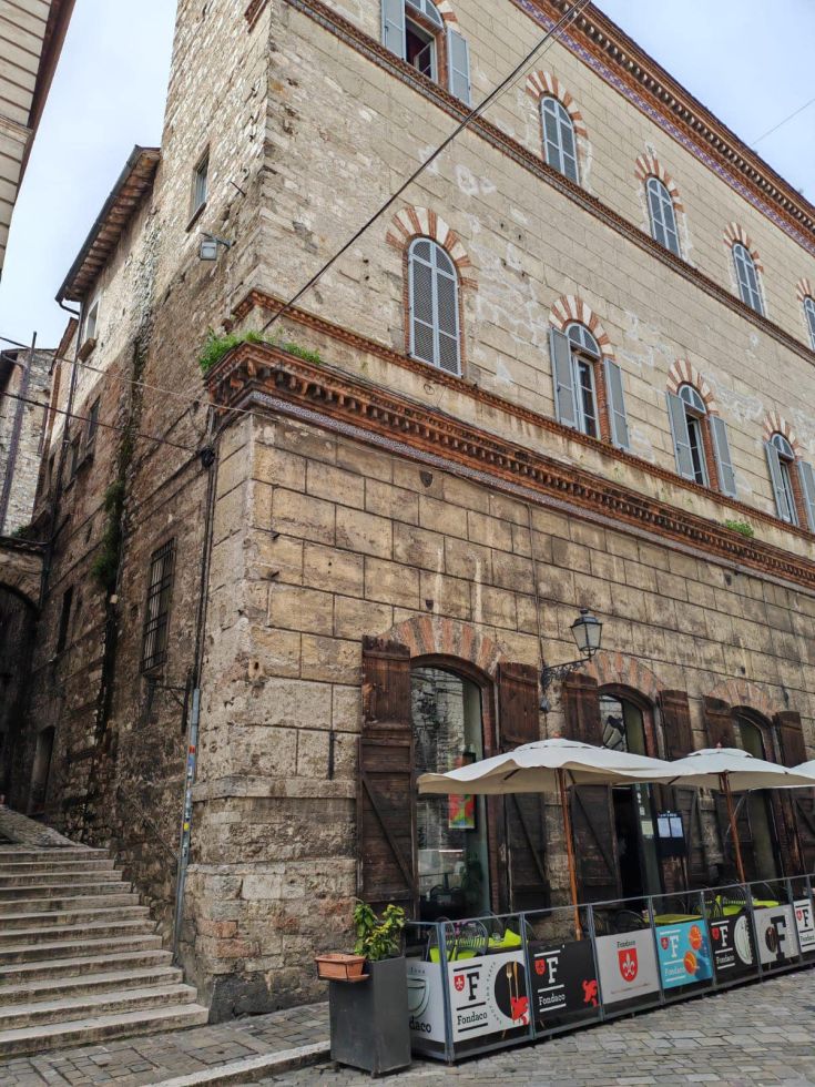 Historic building in the center of Narni, featuring architectural details and a welcoming outdoor space.