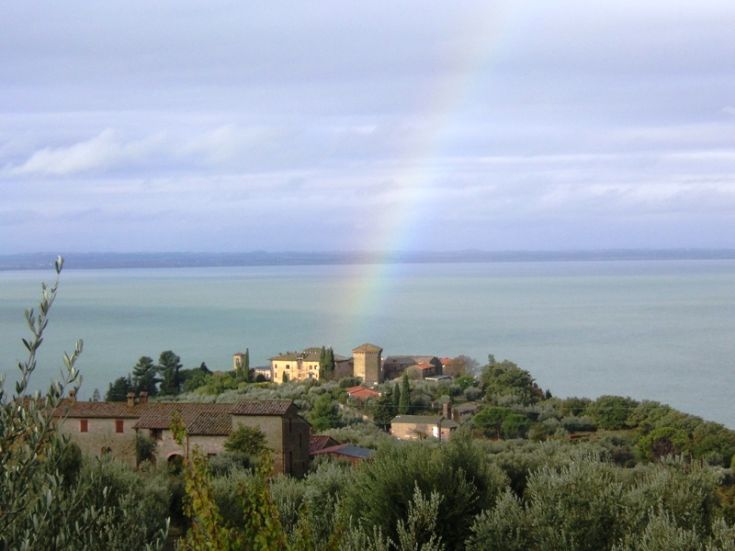 A scene on Lake Trasimeno, with a rainbow reflecting on the waters.