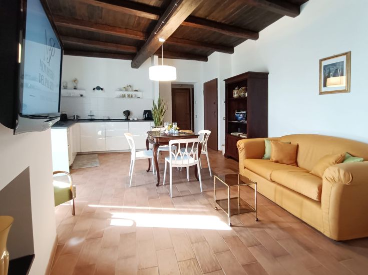 Spacious and bright apartment with kitchen, living room, and terrace overlooking the city. Simple and comfortable furnishings.