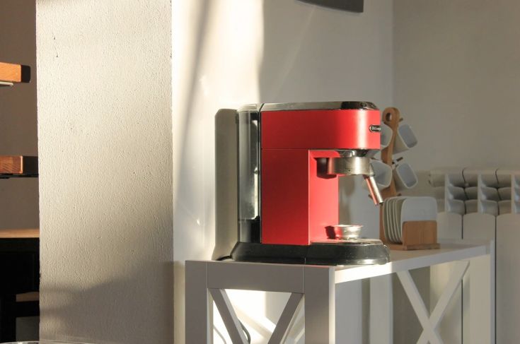 Red coffee machine that adds a modern touch to the kitchen.