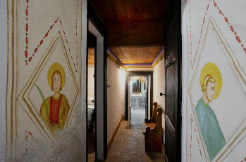 A hallway adorned with decorations on white walls, creating a traditional atmosphere.