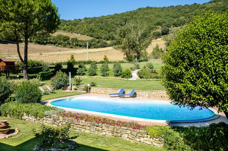 Spacious holiday home with a pool surrounded by a large garden, perfect for families seeking relaxation.