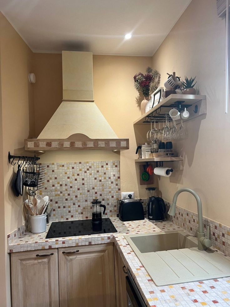 Modern kitchen with practical furniture, simple details, and high-quality materials.