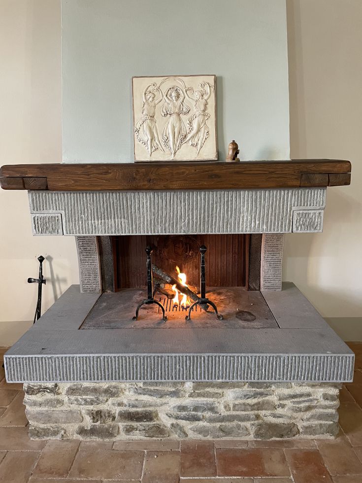 A warm path with vivid flames radiating heat, featuring a decorative element above, creating a cozy atmosphere.