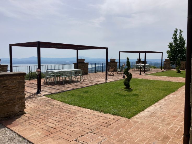 An outdoor area of Villa Gosparini, perfect for relaxation, surrounded by lush greenery.