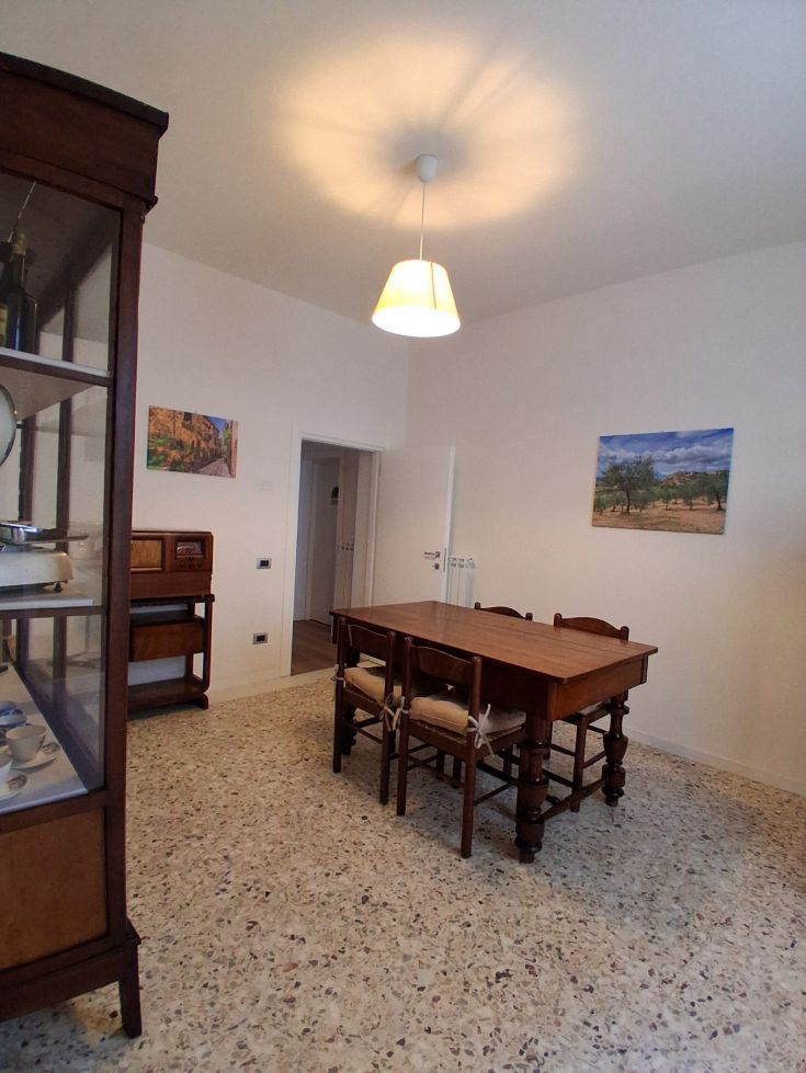 A simple lunch setting featuring a wooden table and some wall decorations.