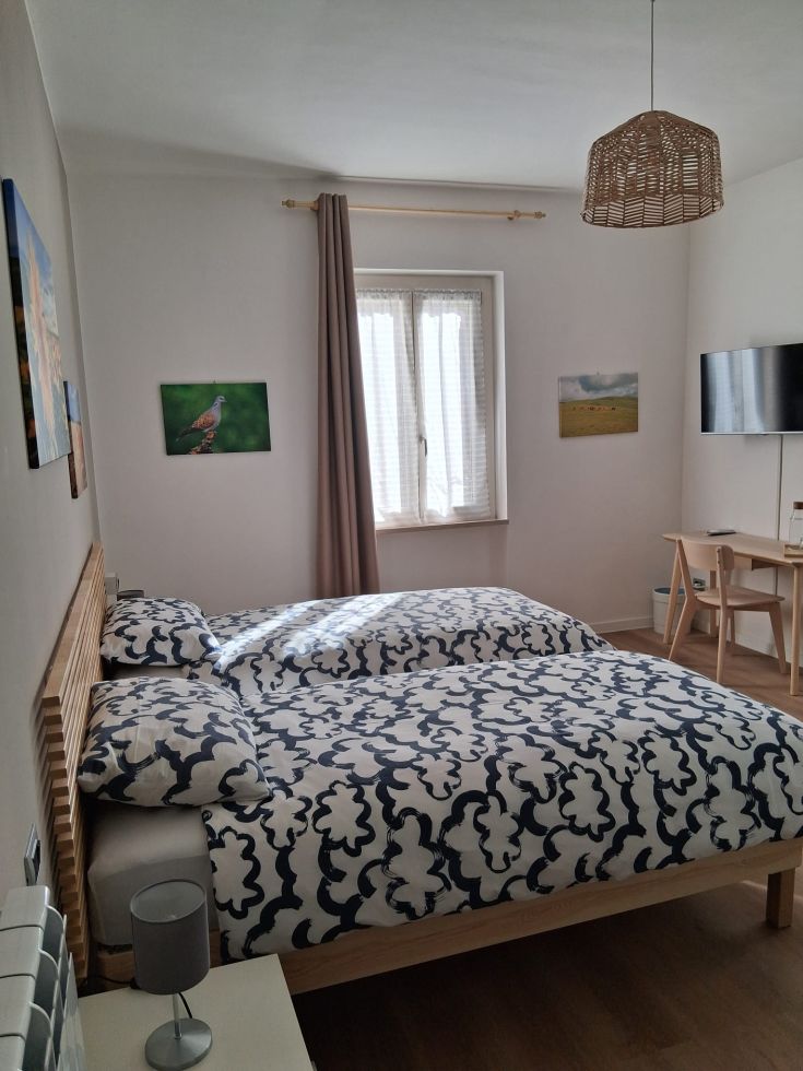 Comfortable room with a double bed and simple decor, perfect for a peaceful stay.