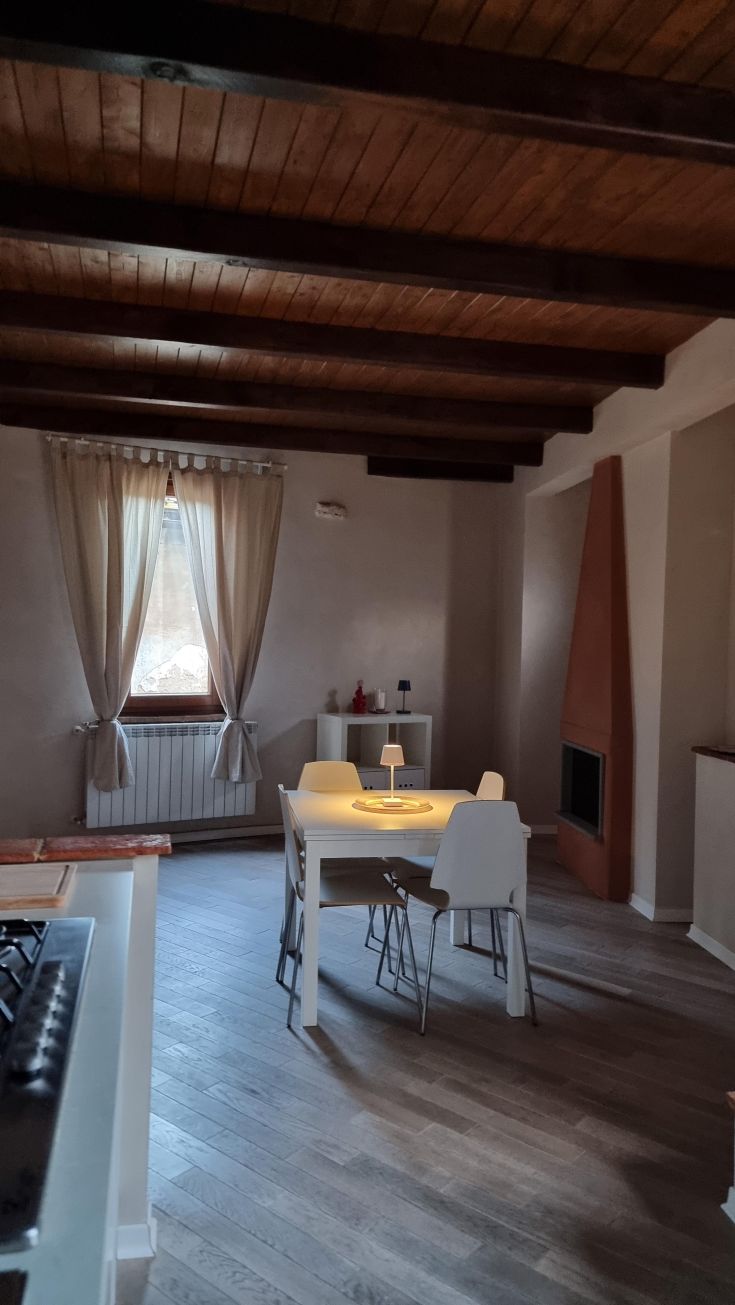 Interior of a modern apartment featuring simple furnishings and a cozy atmosphere.