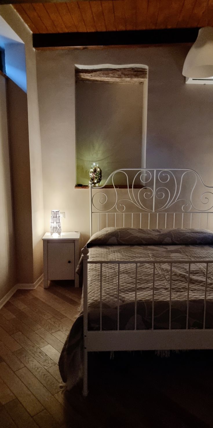 Cozy bedroom with well-arranged beds and soft lighting, perfect for relaxation.