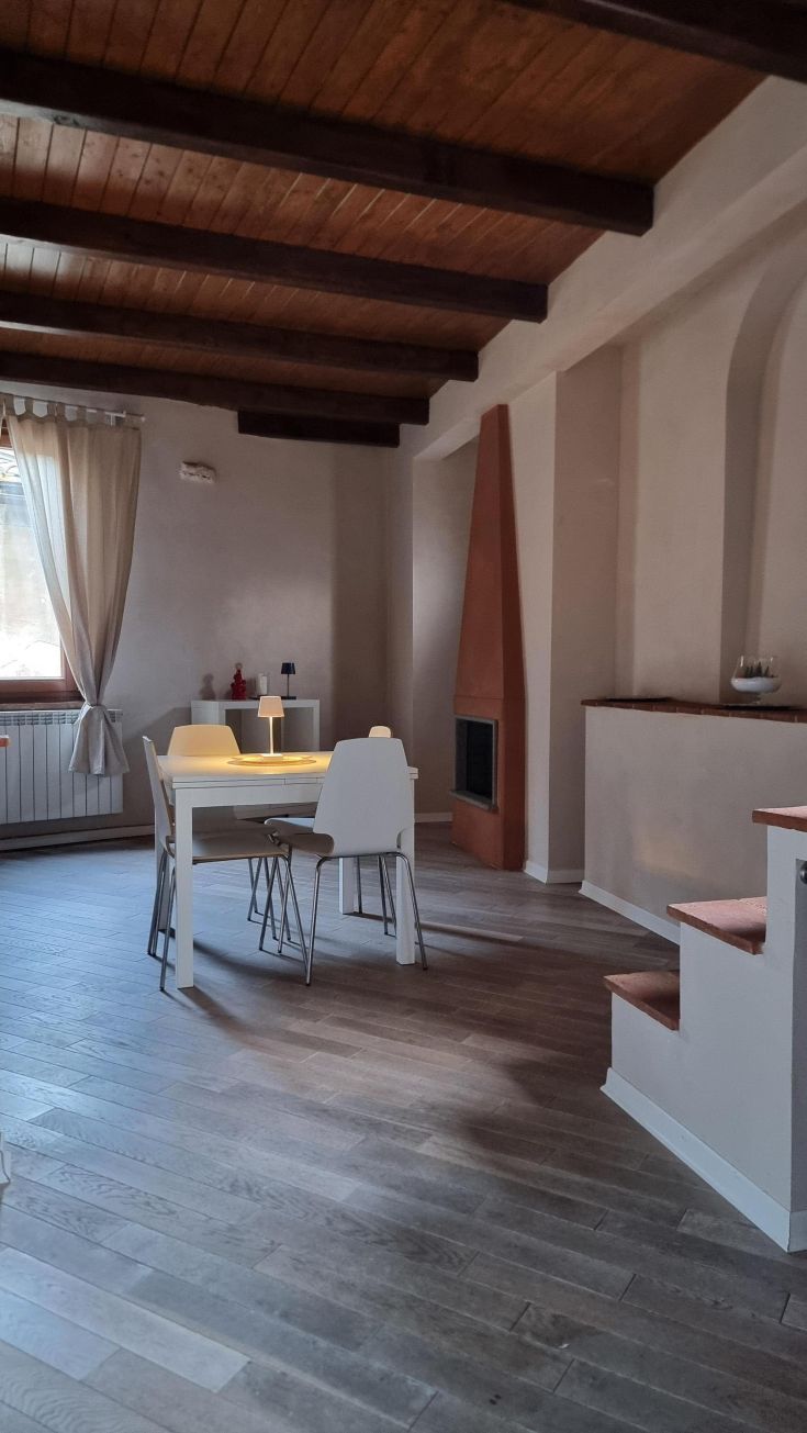 Interior of a renovated, bright, and cozy apartment featuring modern furnishings.