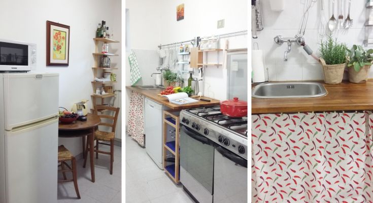 Functional kitchen with table, refrigerator, and colorful decorations. Practical and tidy setting.