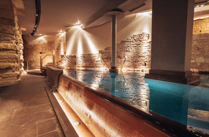 A comfortable area with a pool, blending historical and modern elements in a tranquil atmosphere.